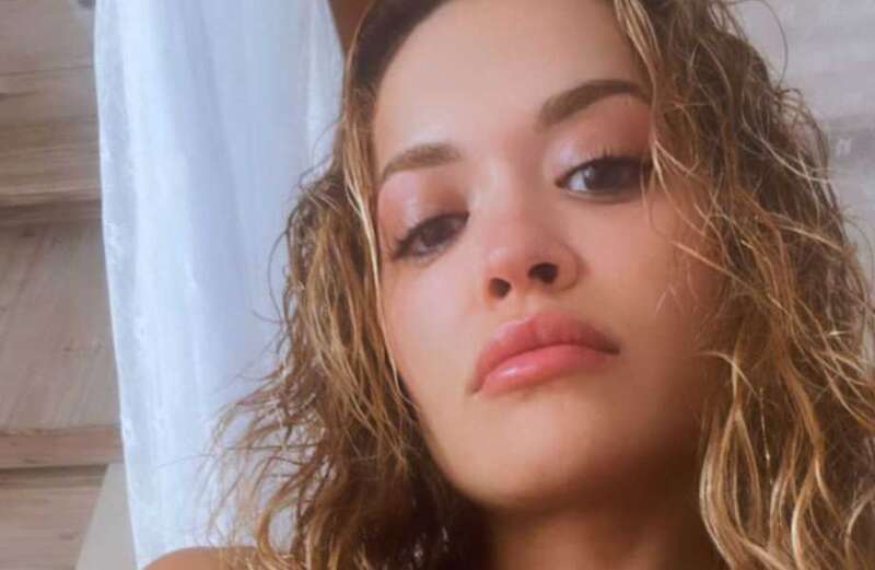 Rita Ora poses in red chequered bikini as she plots music comeback