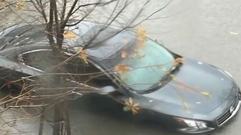 Terrifying flooding leaves 20 cars underwater and residents forced to flee home