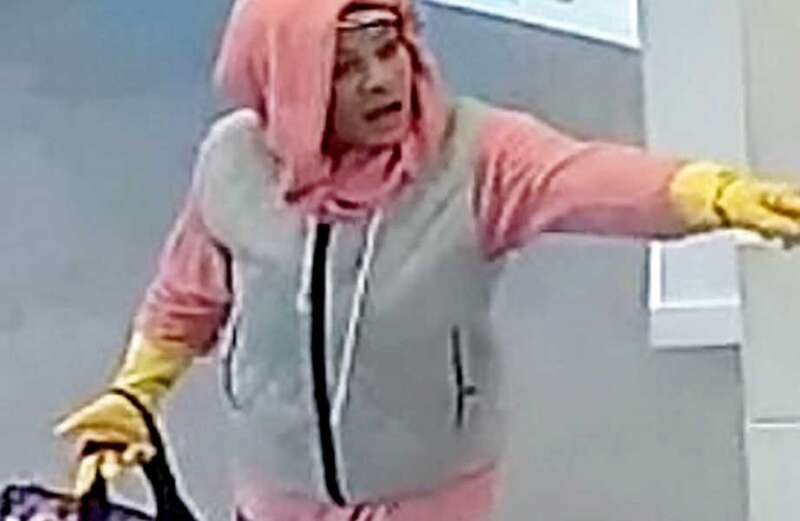 Crook tries to hold up bank wearing Marigolds - but is caught yellow-handed