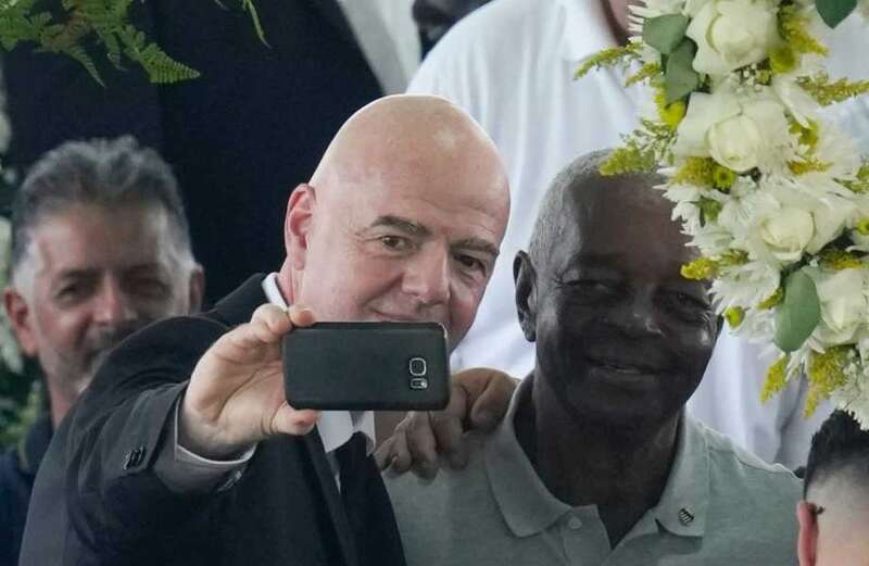 Fifa boss Gianni Infantino appears to take selfie next to Pele's coffin