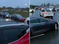 Watch as Tesla drivers are forced to wait hours in queue for charging station