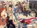 Girl chased and attacked by 16 men for 'dressing immodestly' at Iraq biker event qhidqkikdikprw