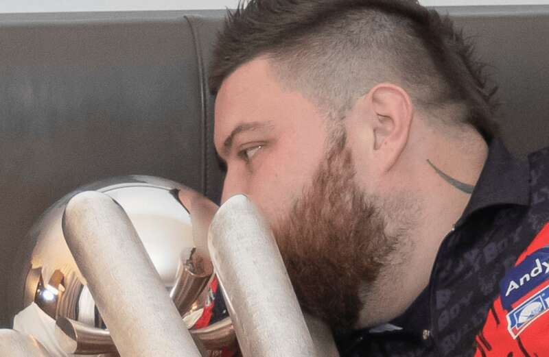 Moment Michael Smith recreates iconic Messi World Cup bed pic with darts trophy