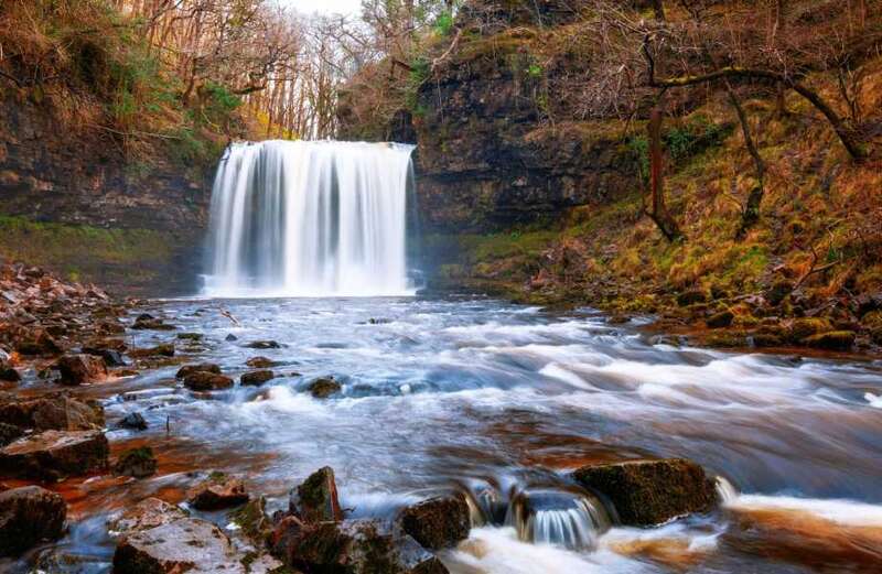 Tragedy as woman's body pulled from waterfall amid desperate search for another