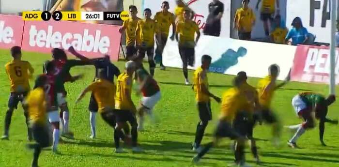 Watch footballers punch and kick each other in shocking mass brawl