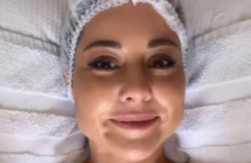 Louise Thompson strips to a towel for 'abdominal massage' after C-section