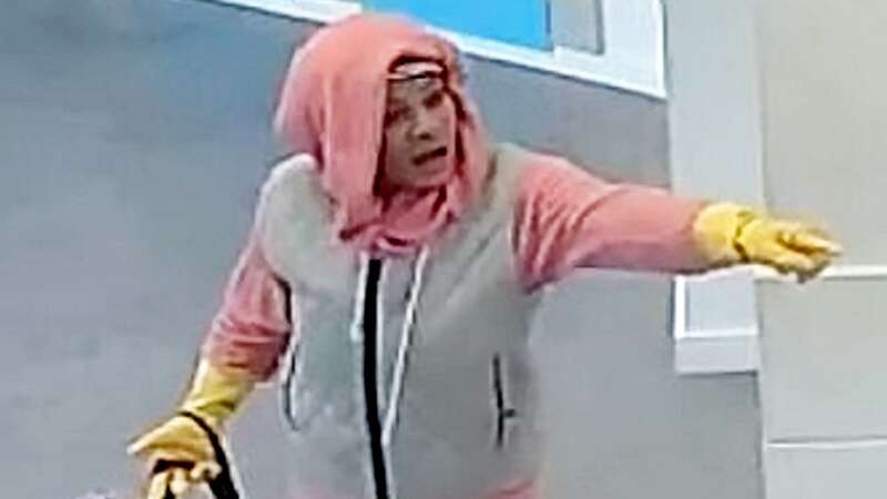 Police are searching for this woman after an attempted bank robbery (Image: West Midlands Police / SWNS)