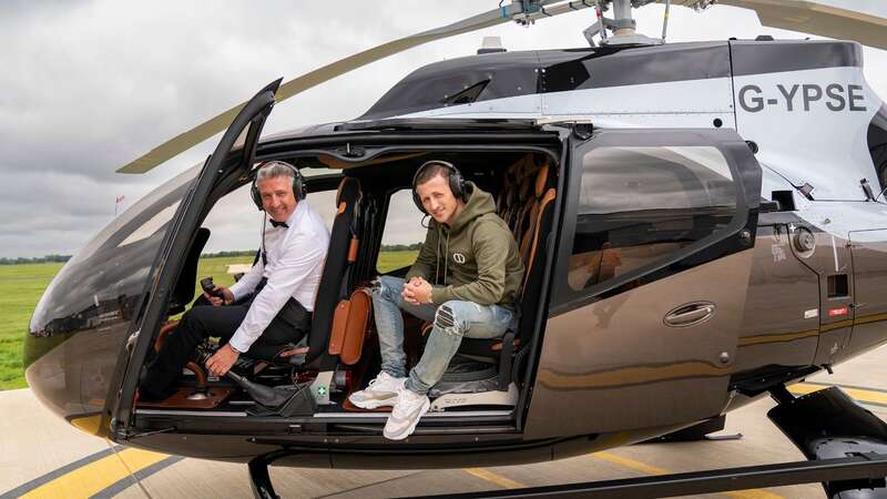 Alfie inside the seven-seat 007 chopper with his son, Alfie (Image: News Group Newspapers Ltd)