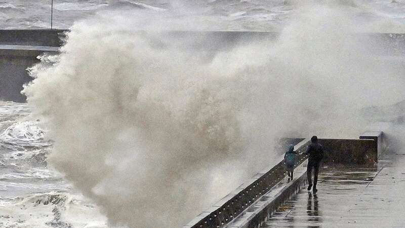 An enormous wave nearly hit the child (Image: Dave Nelson)