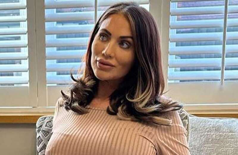 Pregnant Amy Childs poses in just a dressing gown