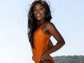 British Miss Universe Noky Simbani wows in orange swimsuit ahead of show