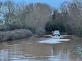 Firefighters wade into flood water to save baby trapped in car as driver slammed