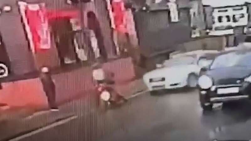 Moment Audi driver mows down motorcyclist in busy city street