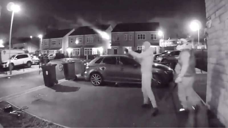 Watch terrifying moment masked thugs attack home with shotgun and sledgehammer