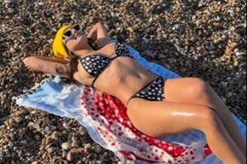 Ex-porn star Mia Khalifa mocks Brits as she shares snap relaxing on the UK beach in bikini