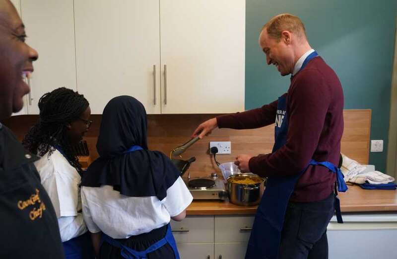 Wills shrugs off Harry's bombshell bio and cooks with kids on charity visit