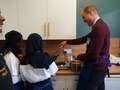 Wills shrugs off Harry's bombshell bio and cooks with kids on charity visit