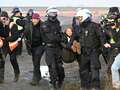 Greta Thunberg detained by police as she's seen being carried away by officers