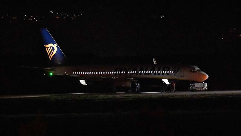 A bomb disposal team inspects the Ryanair plane from Poland (Image: AFP via Getty Images)