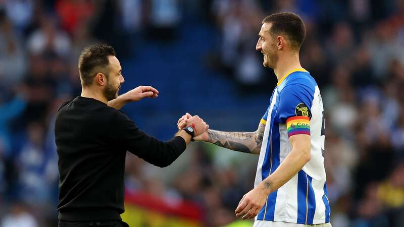 BRIGHTON, ENGLAND - OCTOBER 29: Roberto De Zerbi embraces Lewis Dunk of Brighton & Hove Albion after their sides victory during the Premier League match between Brighton & Hove Albion and Chelsea FC at American Express Community Stadium on October 29, 2022 in Brighton, England. (Photo by Bryn Lennon/Getty Images) (Image: Bryn Lennon/Getty Images)