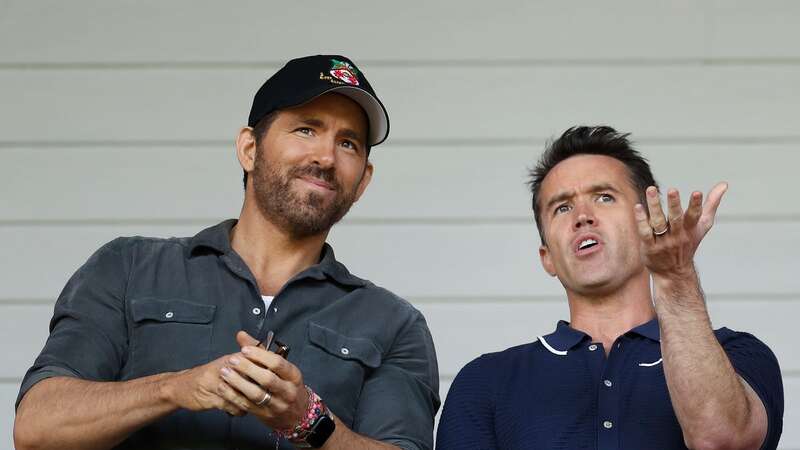 WREXHAM, WALES - MAY 28: Ryan Reynolds, Owner of Wrexham and Rob McElhenney, Actor and Co-Owner of Wrexham react prior to the Vanarama National League Play-Off Semi Final match between Wrexham and Grimsby Town at Racecourse Ground on May 28, 2022 in Wrexham, Wales. (Photo by Lewis Storey/Getty Images)