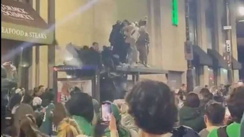 Philadelphia Eagles fans fell through the roof of a bus shelter as they celebrated the NFC Championship Game win