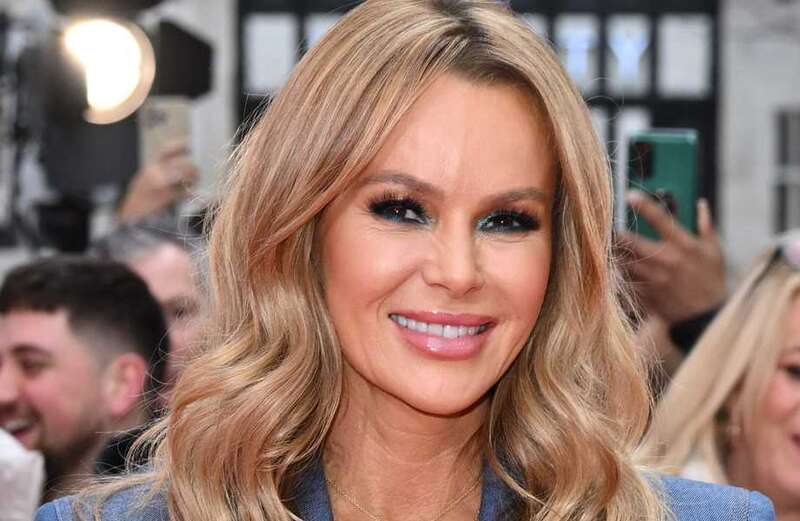 Amanda Holden, 51, shows off her incredible figure in lacy red lingerie