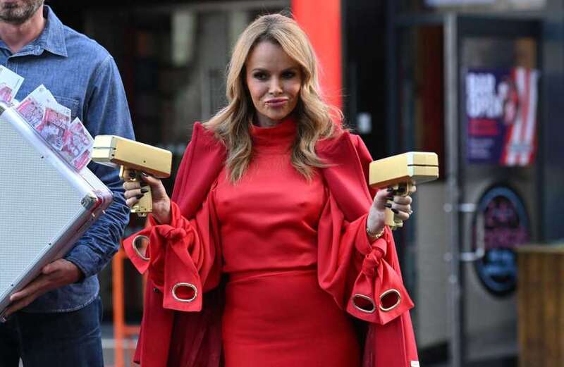 Amanda Holden goes braless as she leaves radio show in bright red outfit