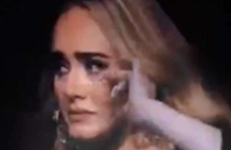 Adele bursts into tears on stage as fan shows her photo of his late wife