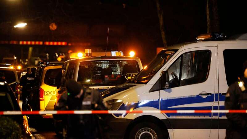 Police officers stand at a barrier near the scene of the accident (Image: Thomas Banneyer/picture-alliance/dpa/AP Images)