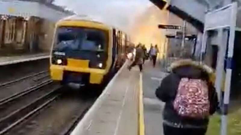 Train bursts into flames forcing passengers to run for their lives