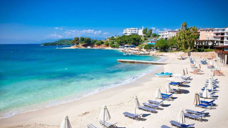 Sunshade umbrellas and deckchairs on the beautiful Ksamil beach (Image: Getty Images/iStockphoto)