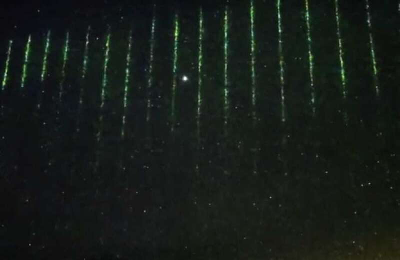 Watch mysterious green 'laser lines' beam across sky like 'digital rain'