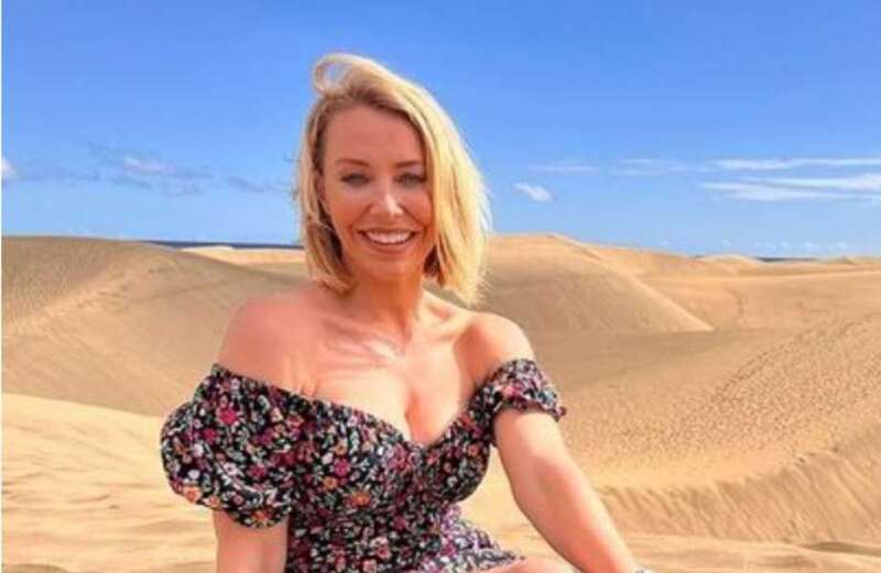 Laura Hamilton wows fans as she poses on beach in strapless minidress