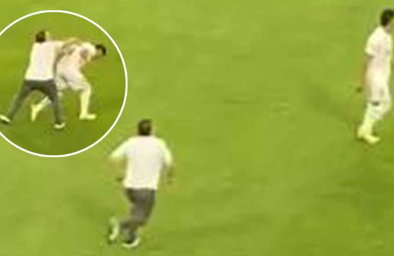 Watch shocking moment fan attacks player on the pitch but soon wishes he hadn't