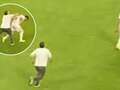 Watch shocking moment fan attacks player on the pitch but soon wishes he hadn't