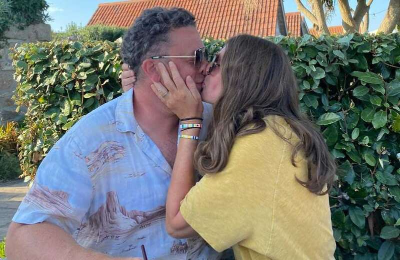 TV Chef looks unrecognisable as he kisses wife - can you tell who it is?