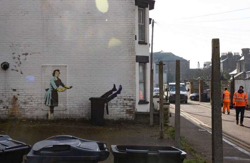 Council blasted for ruining Banksy mural as artwork replaced with WHEELIE BIN