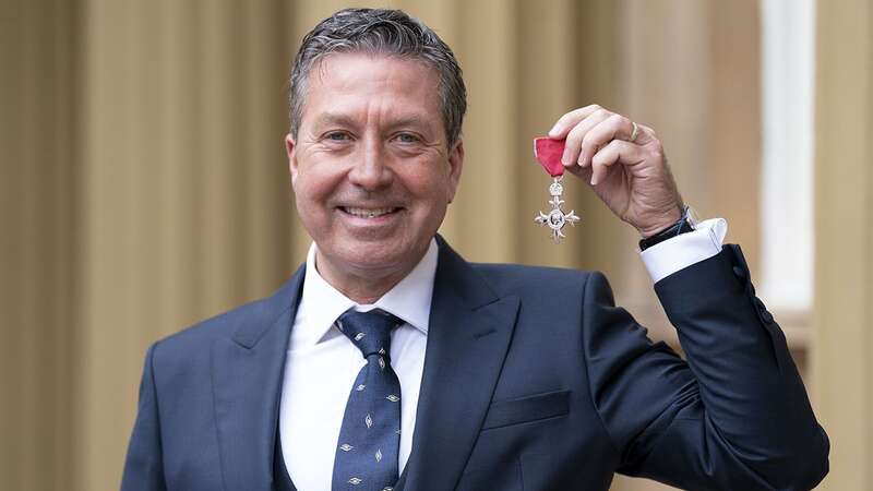 John Torode beams with joy as he receives MBE from Prince William