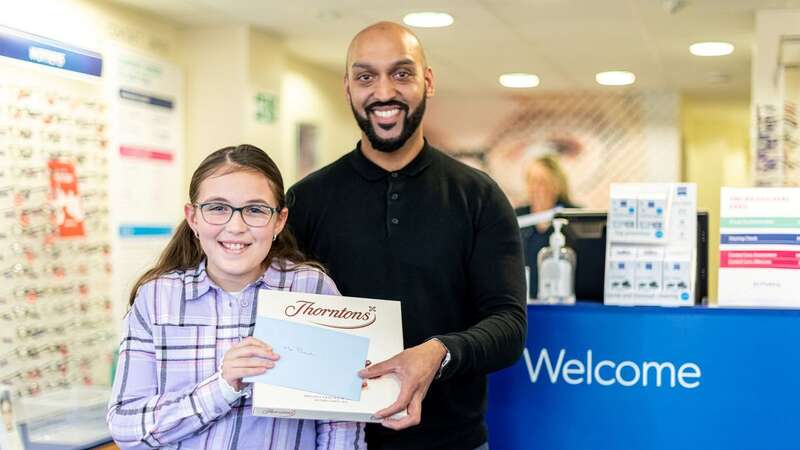 Poppy-May Leeds thanks optometrist Mrudang Patel at Scrivens, Herne Bay (Image: SWNS)