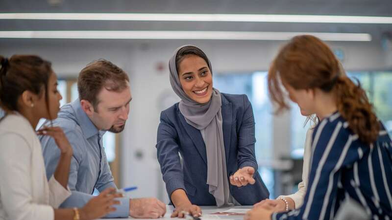 A Muslim women college taking part in a work meeting (Image: Getty Images)