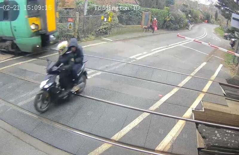 Moment moped narrowly misses being hit by 70mph train as it dodges barriers