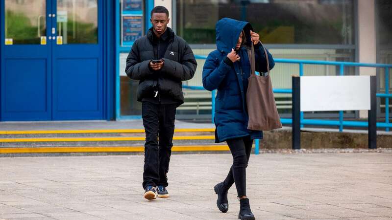 Adekoya Odukoya, left, and Suliat Okunlola leaving Poole Magistrates Court. (Image: BNPS)