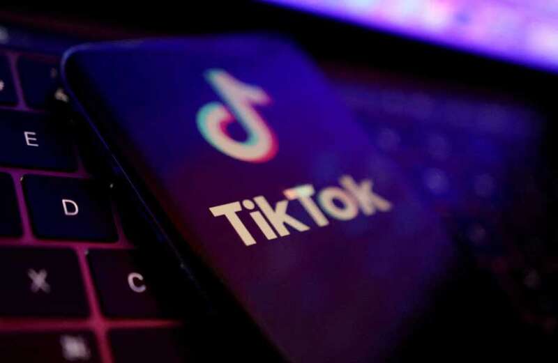 Mobiles 'should be banned from classes to stop TikTok riots'