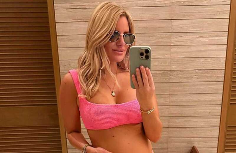 Pregnant Danielle Armstrong shows off growing baby bump in pink bikini