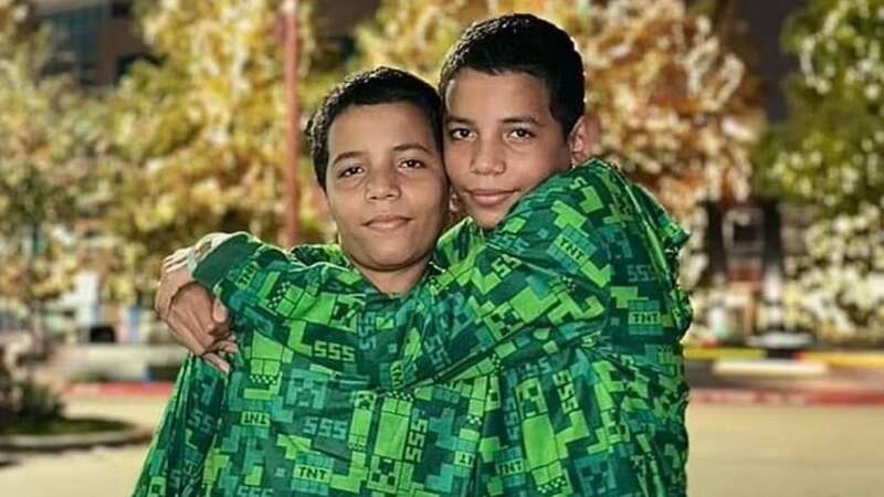 Body found in search for twin brothers, 13, who vanished swimming off pier