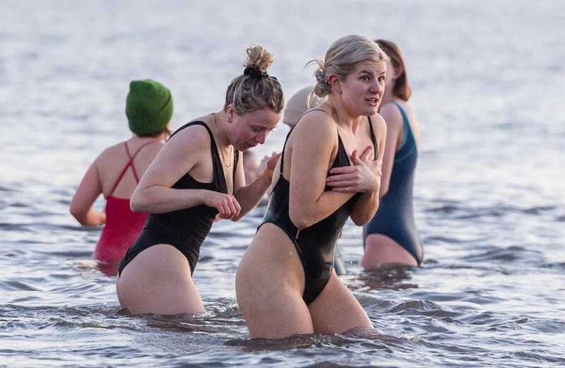 Swimmers defy sub-zero temperatures to take dip for International Women's Day