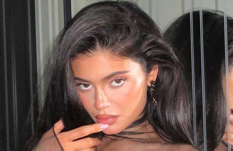 Kylie shows off cheekbones and puffy pout in new pics amid surgery claims