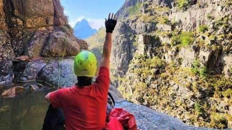 A Wilderness Search and Rescue rescuer guides a helicopter into the Banhoek mountain range (Image: Wilderness Search & Rescue)