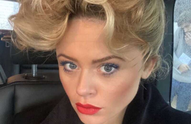 Emily Atack looks just like Sandy from Grease posing with different hairstyle